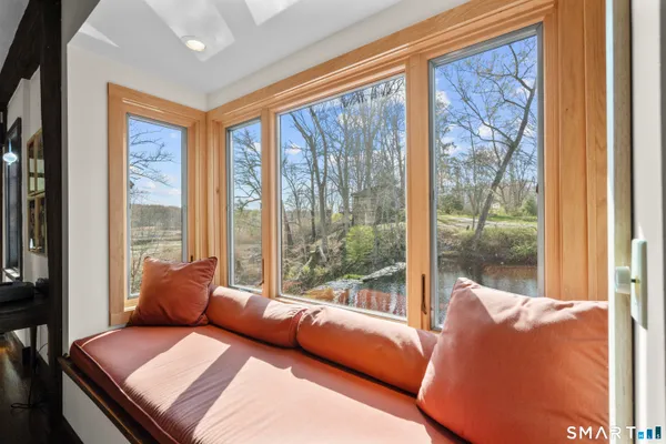 a room with furniture and a large window