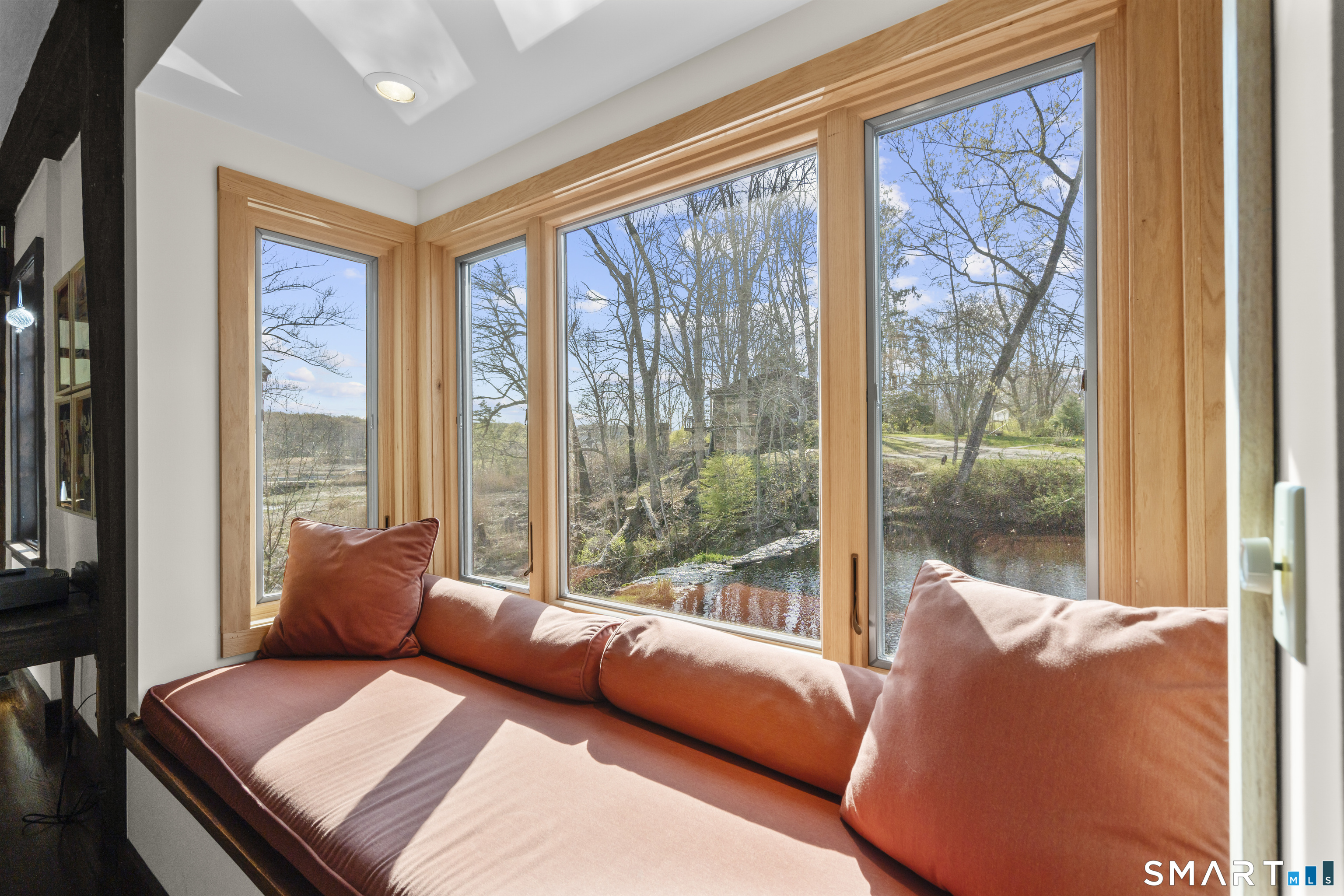 55-69 Sawmill Road Branford, CT 06405 - Photo 17 of 40 a room with furniture and a large window