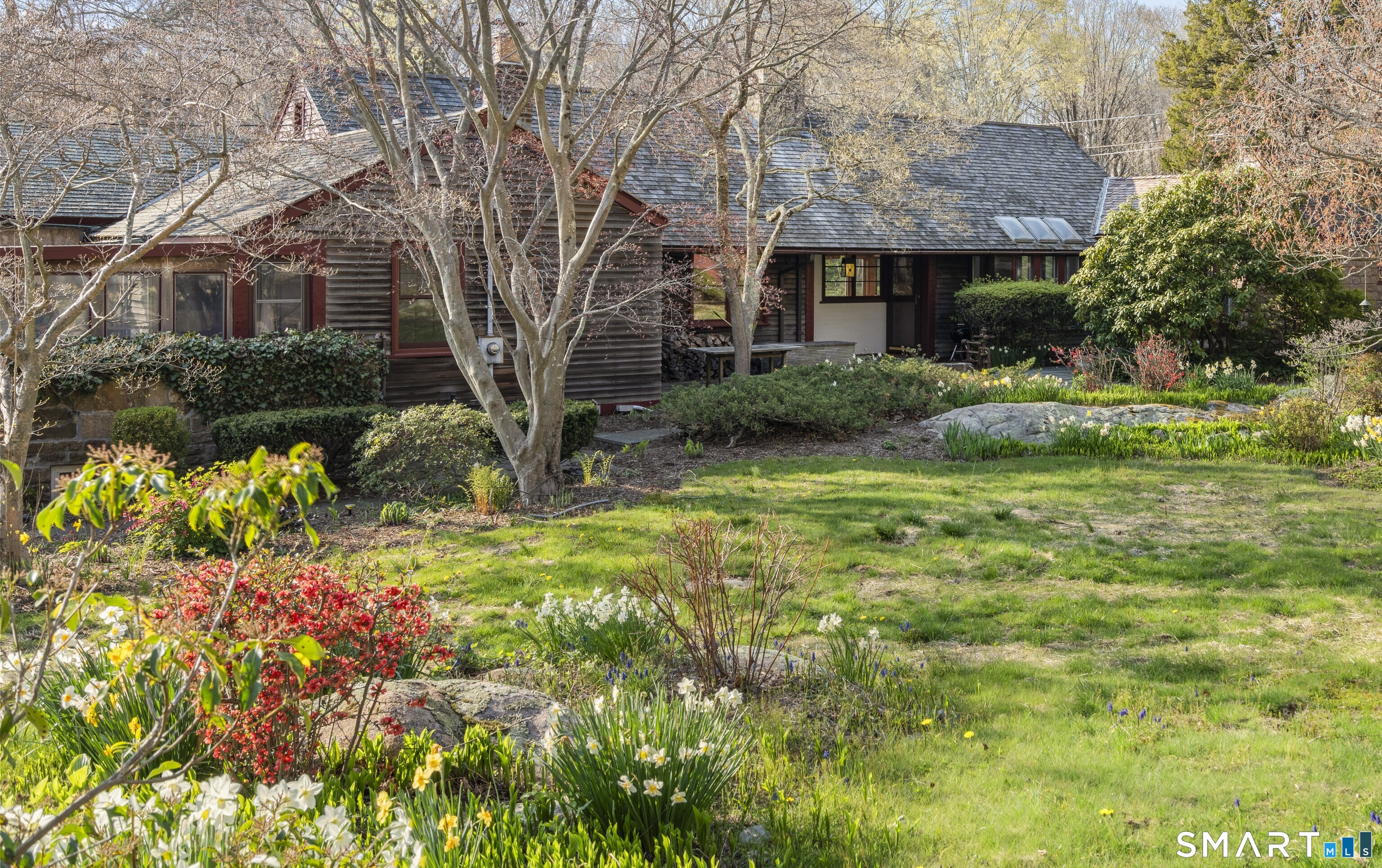 55-69 Sawmill Road Branford, CT 06405 - Photo 2 of 40 a front view of a house with garden