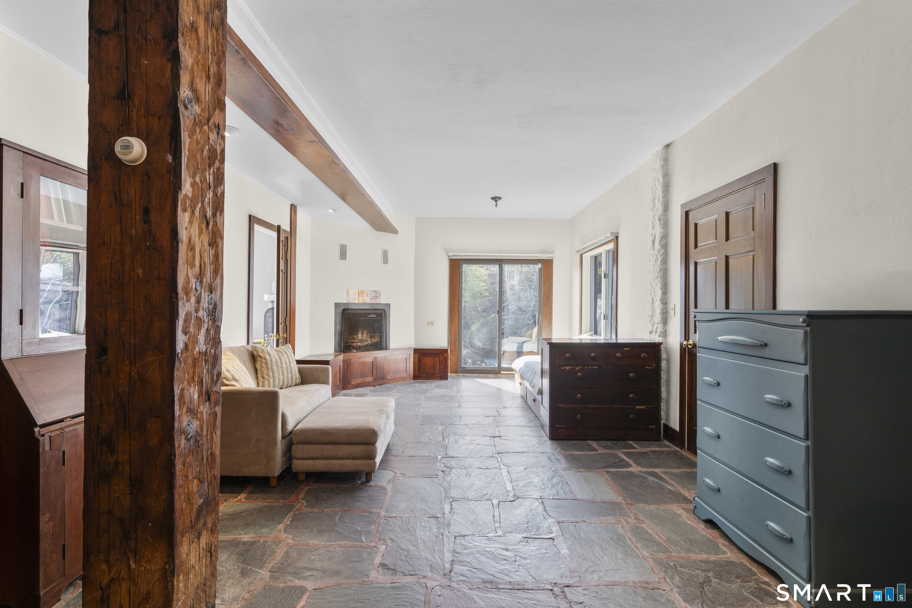 55-69 Sawmill Road Branford, CT 06405 - Photo 30 of 40 a bedroom with furniture and a balcony