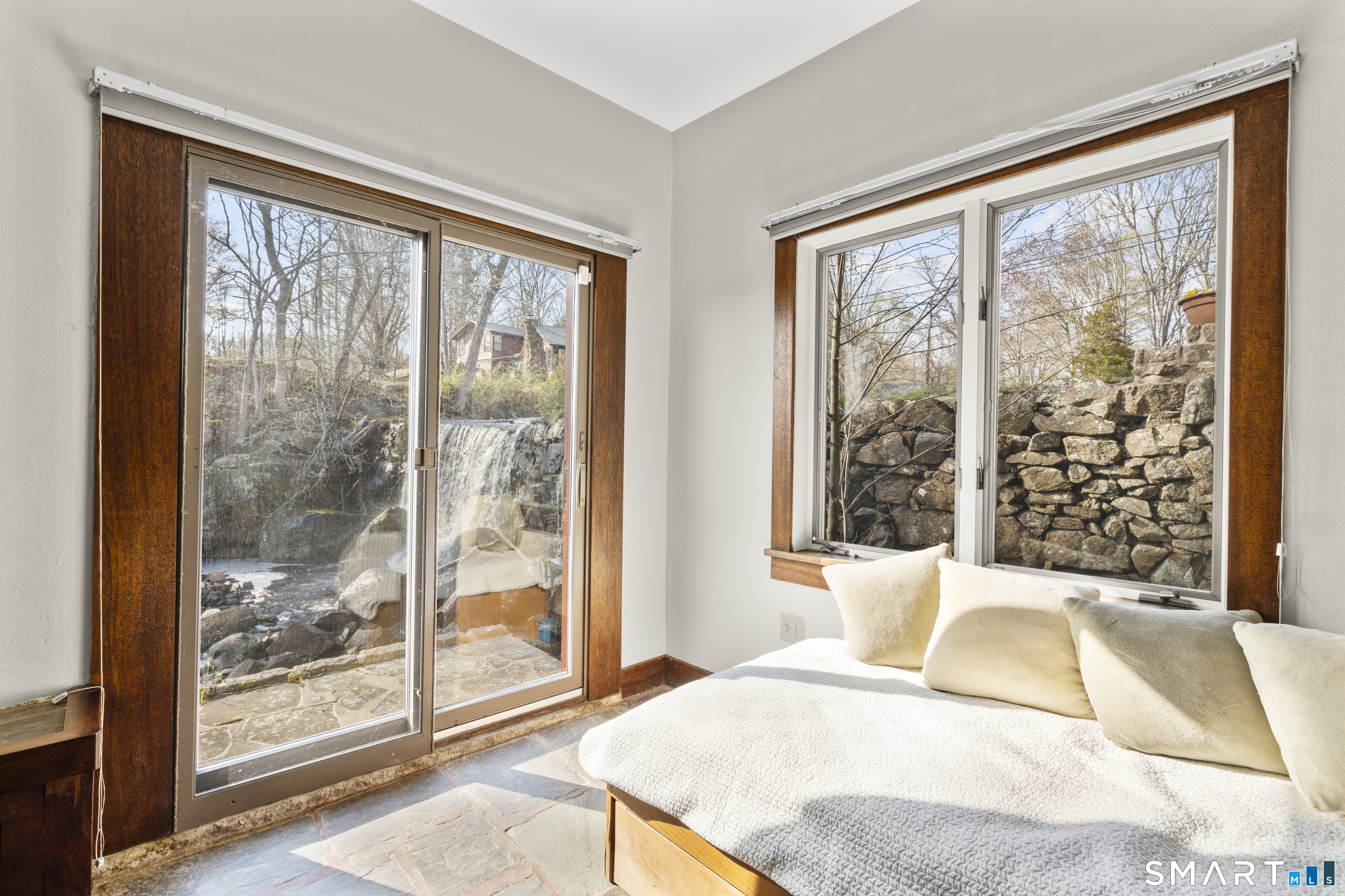 55-69 Sawmill Road Branford, CT 06405 - Photo 31 of 40 a bedroom with a large bed and a large window