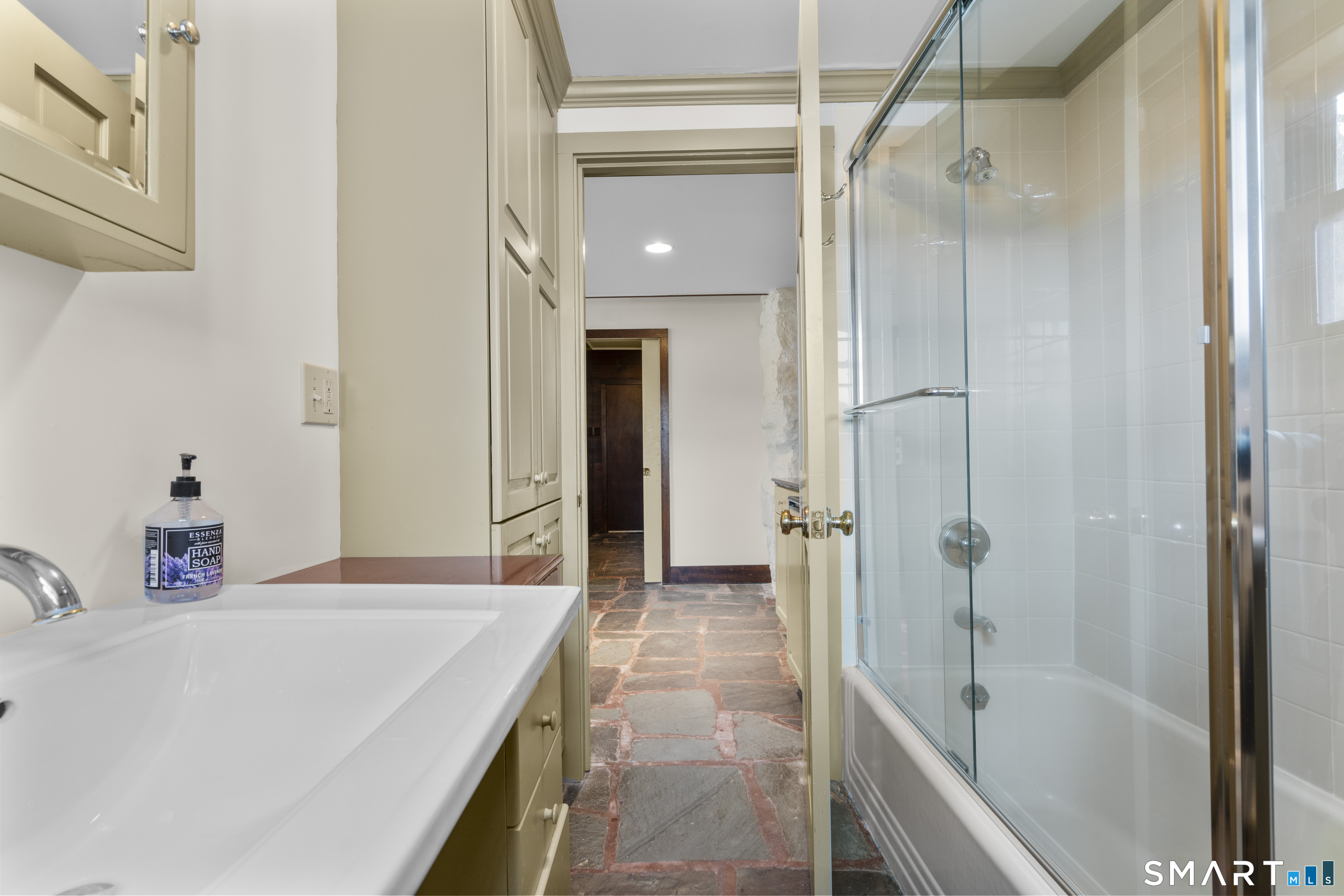 55-69 Sawmill Road Branford, CT 06405 - Photo 35 of 40 a bathroom with a bathtub and a shower
