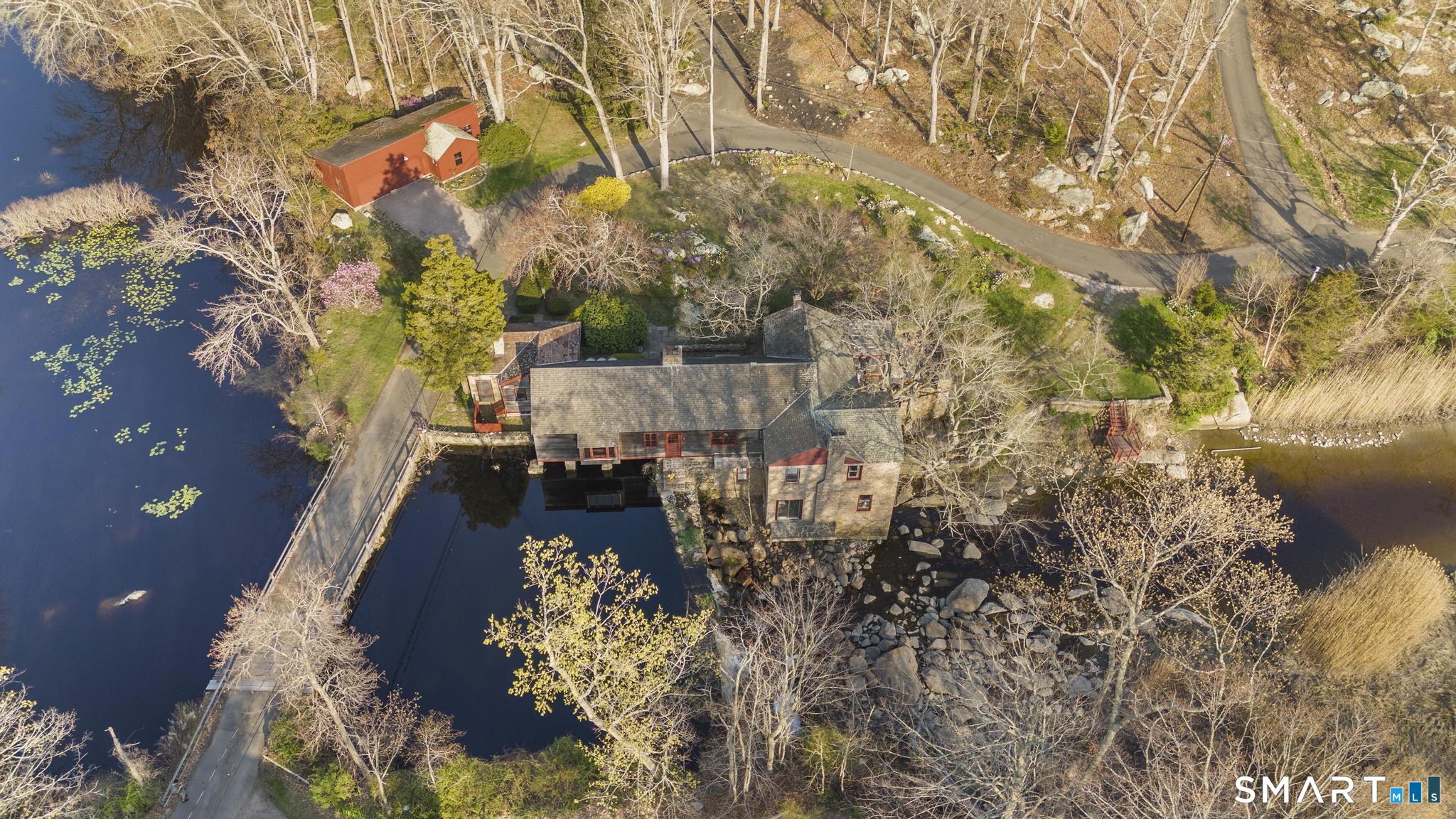 55-69 Sawmill Road Branford, CT 06405 - Photo 4 of 40 a view of swimming pool yard from a lake view