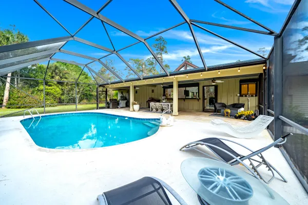 a view of a swimming pool with a patio
