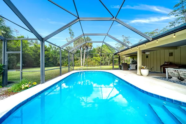 a swimming pool with yard