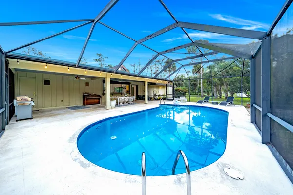 a view of a swimming pool with a patio
