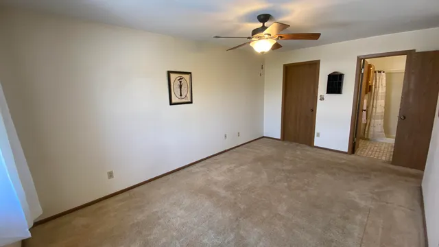 a view of a house with a ceiling fan and a chandelier fan