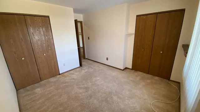 an empty room with wooden floor