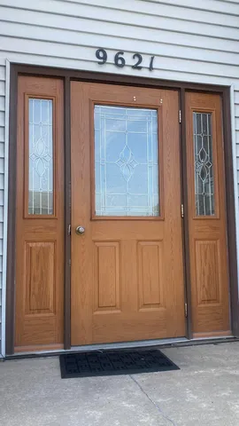 a view of a room with wooden walls
