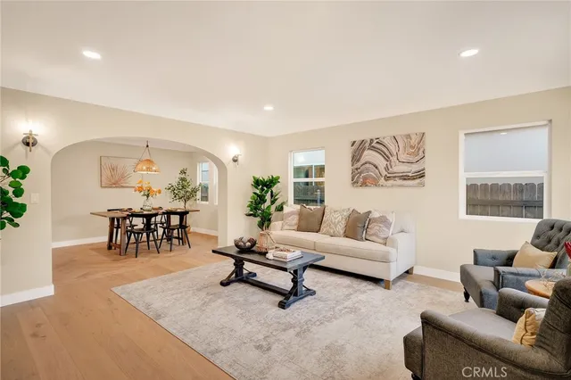 a living room with furniture and a table