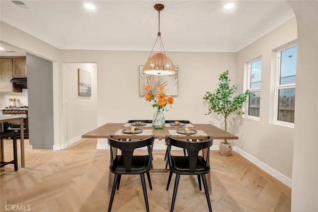 a dining room with furniture and window