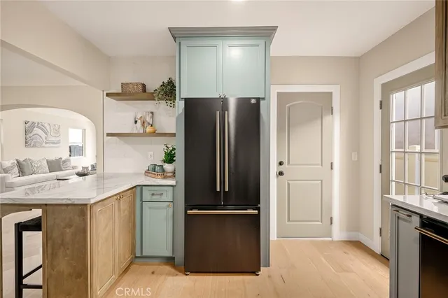 a kitchen with stainless steel appliances granite countertop wooden cabinets a stove top oven a sink and dishwasher