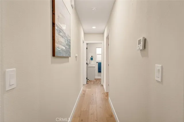a kitchen with a refrigerator and a sink