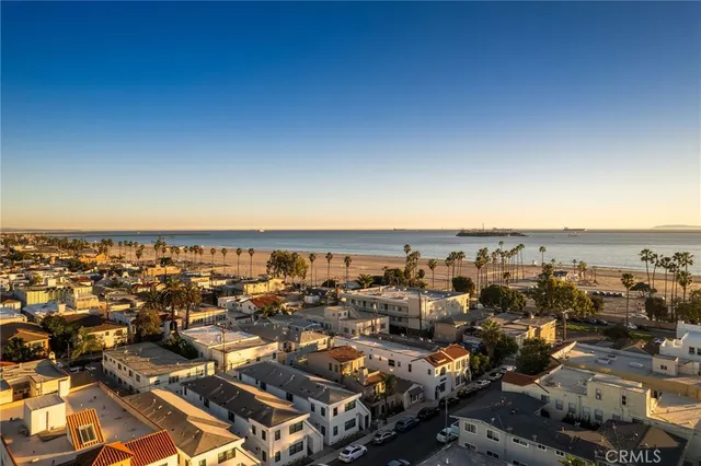 an empty room with chandelier fan