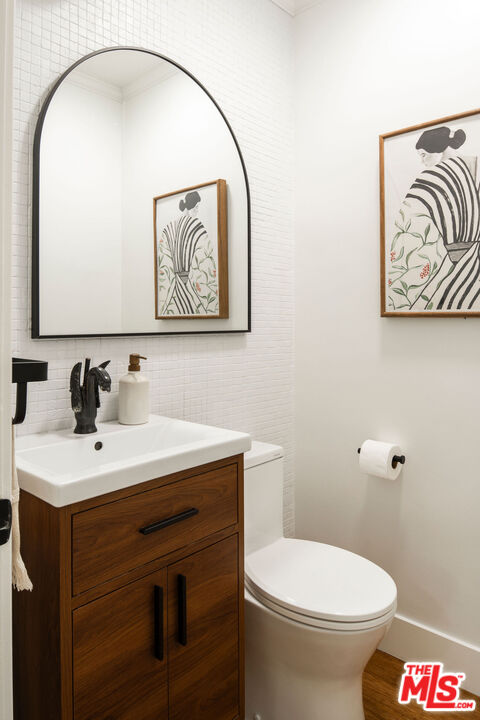 258 Redwood Drive Pasadena, CA 91105 - Photo 12 of 34 a bathroom with a toilet sink and mirror