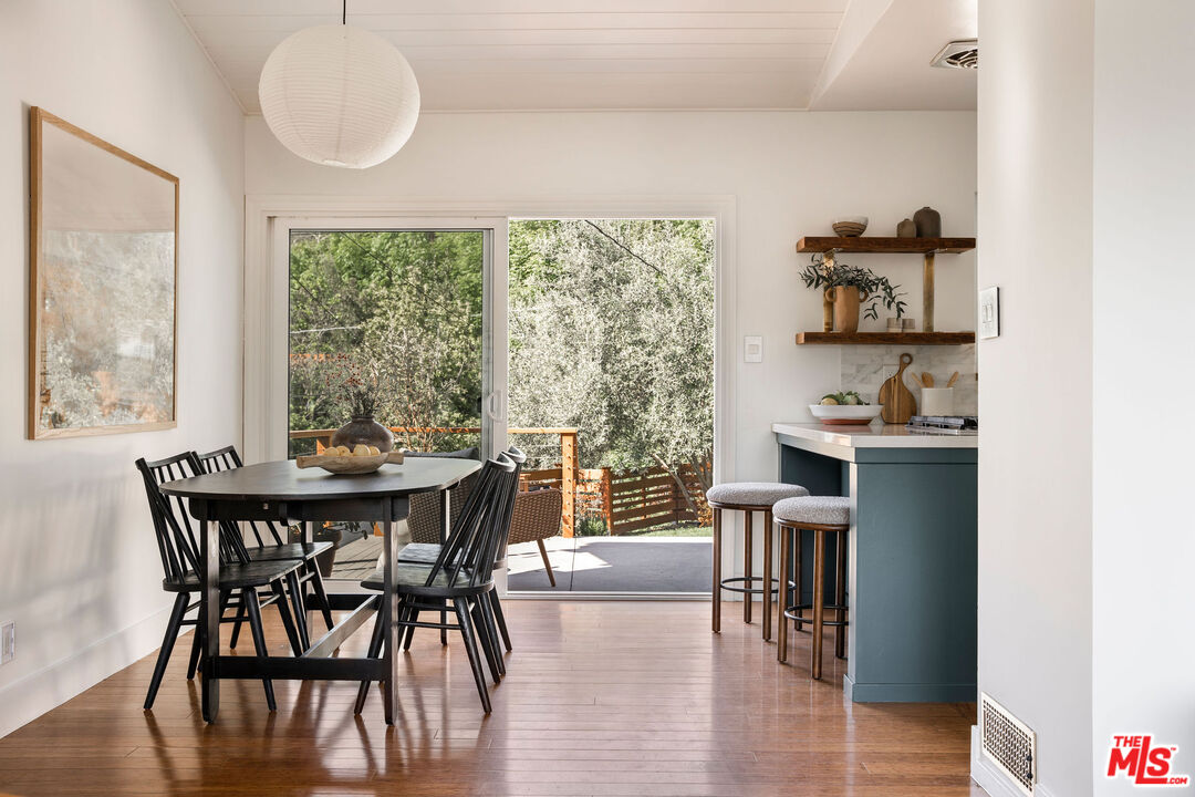 258 Redwood Drive Pasadena, CA 91105 - Photo 14 of 34 a dining room with furniture and wooden floor