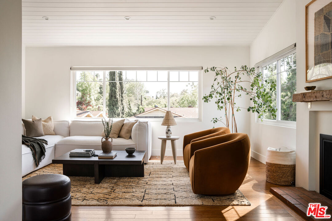 258 Redwood Drive Pasadena, CA 91105 - Photo 5 of 34 a living room with furniture and a floor to ceiling window