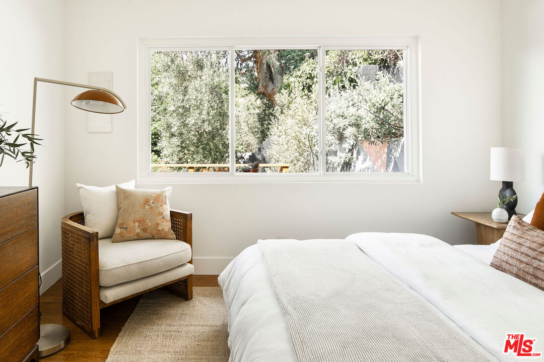 258 Redwood Drive Pasadena, CA 91105 - Photo 9 of 34 a bedroom with a bed and a couch