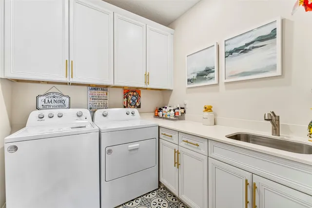 a view of storage and utility room with washer and dryer