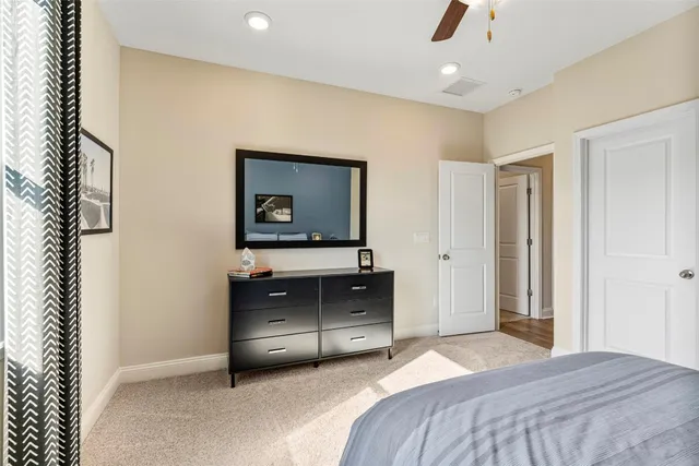 a bedroom with a bed and a television