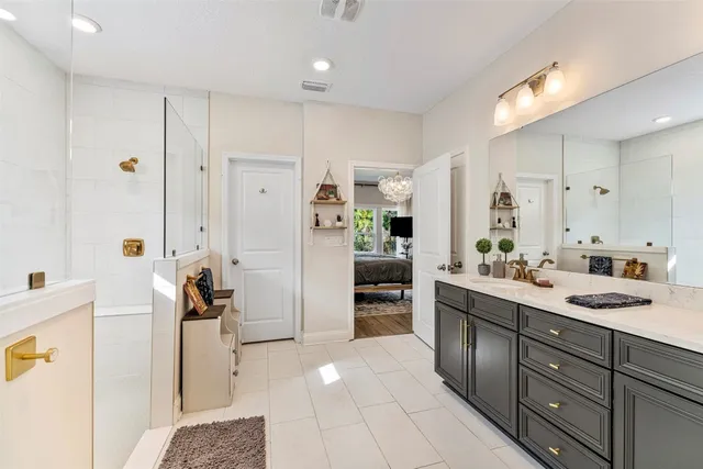 a kitchen with a sink appliances and cabinets
