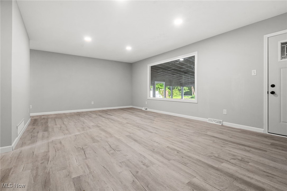 4232 Wilson Avenue Ravenna, OH 44266 - Photo 5 of 28 Unfurnished room with recessed lighting and light wood finished floors