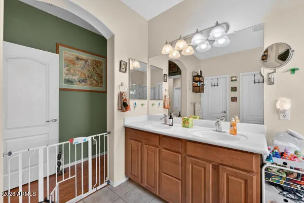 a bathroom with a tub shower and sink