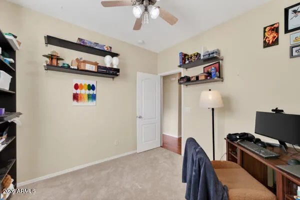 a room with furniture a flat screen tv and a window