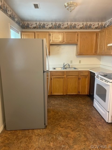 9504 Gayton Road Henrico, VA 23229 - Photo 2 of 8 a kitchen with stainless steel appliances granite countertop a refrigerator a stove and a sink with wooden cabinets