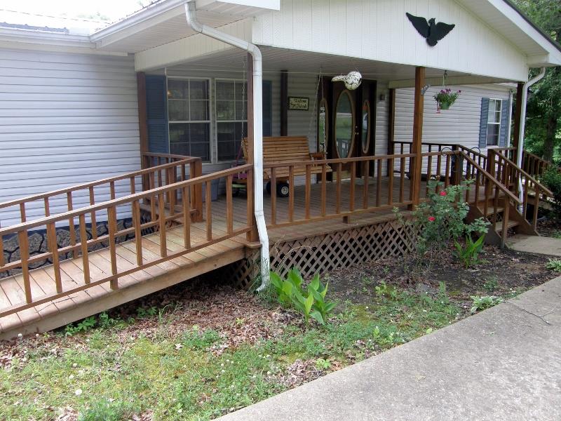 THE COVERED FRONT PORCH HAS EASY ACCESS.