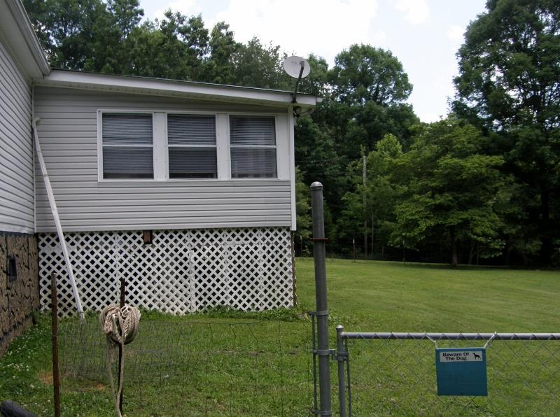 THE 14X32 FLORIDA ROOM AT THE BACK OF THE HOME. 