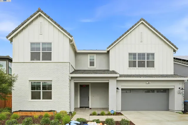 a front view of a house with a garage