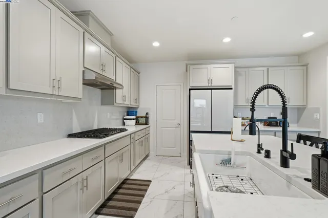 a view of a dining room with furniture and a window