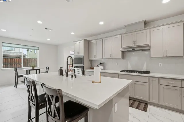 a view of a dining room with furniture and front door