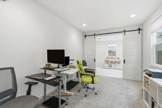 a bedroom with a bed and a lamp