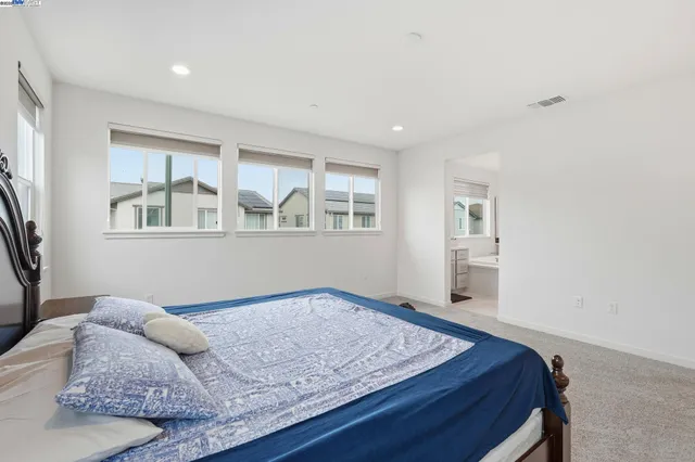 a bathroom with a sink mirror and vanity