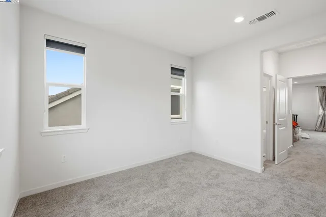 a bathroom with a sink double vanity mirror and shower