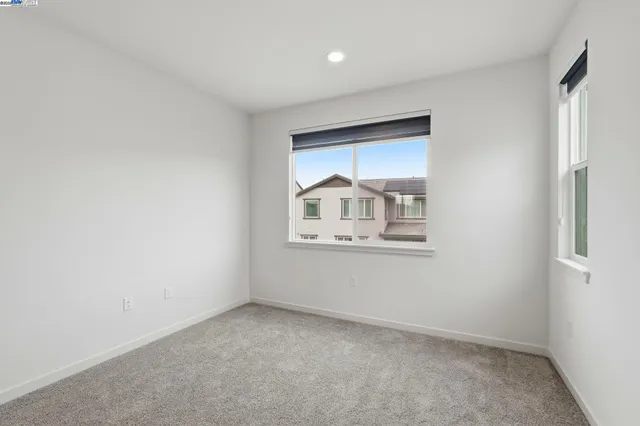 a bathroom with a sink toilet vanity and shower