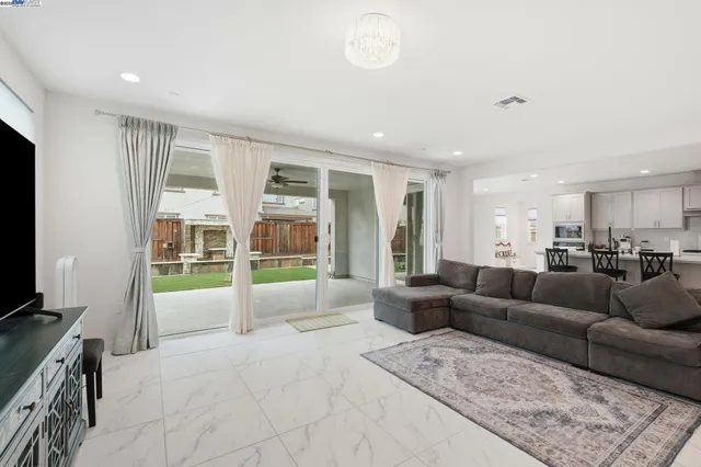a kitchen with sink a stove and cabinets