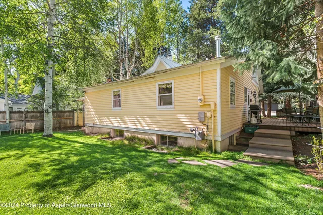 a backyard of a house with lots of green space