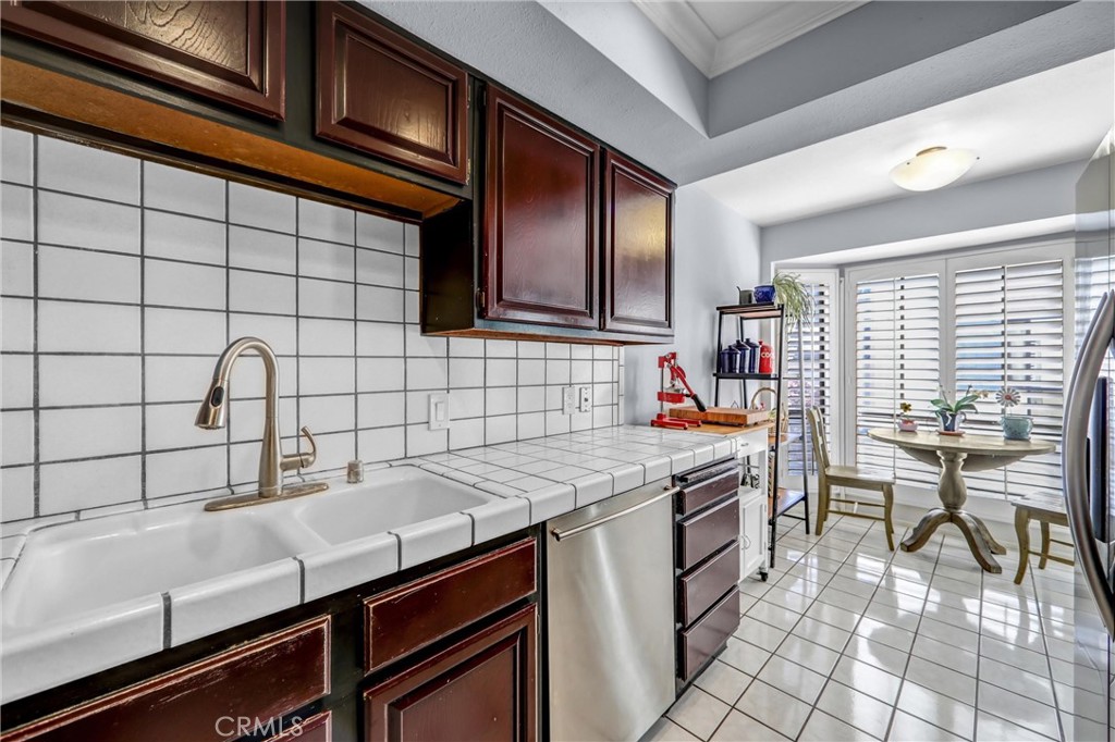 984 West Riverside Drive Burbank, CA 91506 - Photo 14 of 35 a kitchen with a sink cabinets and window