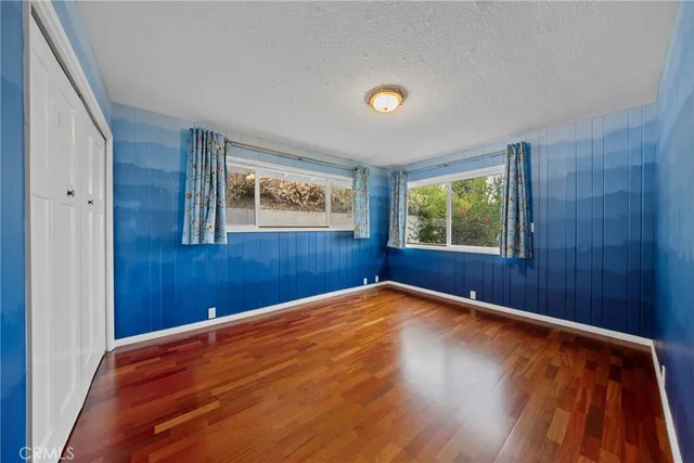 a bathroom with a granite countertop shower mirror and a sink
