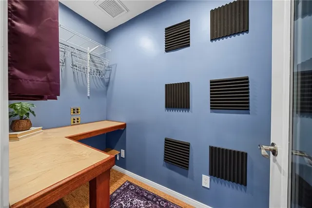 a bedroom with a bed and glass door