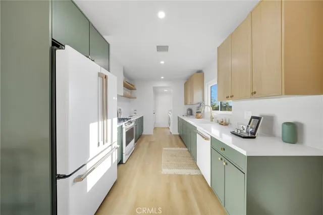 a kitchen with a stove and a sink