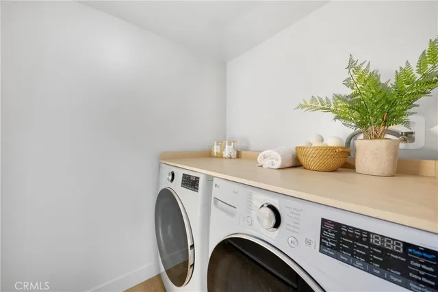 a kitchen with stainless steel appliances sink a stove and cabinets