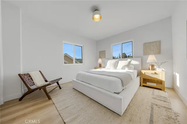 a bedroom with a bed and cabinets