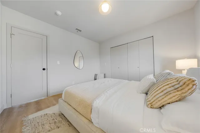 a bedroom with a bed and a couch