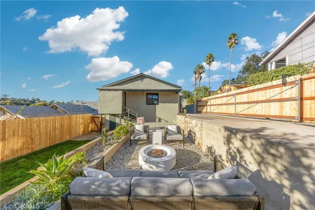 a view of house with outdoor seating