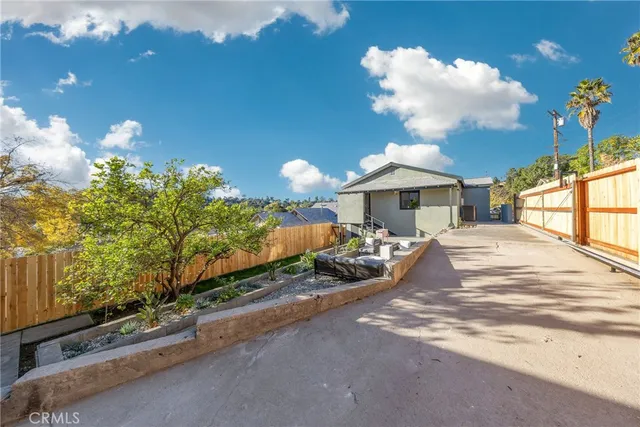 a view of a porch with a table and chairs