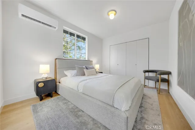 a bedroom with a bed and a lamp